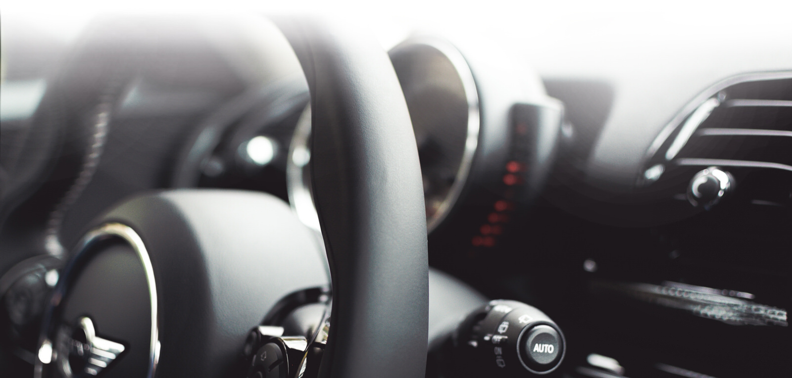 car dashboard and steering wheel inspection by Q2 Management