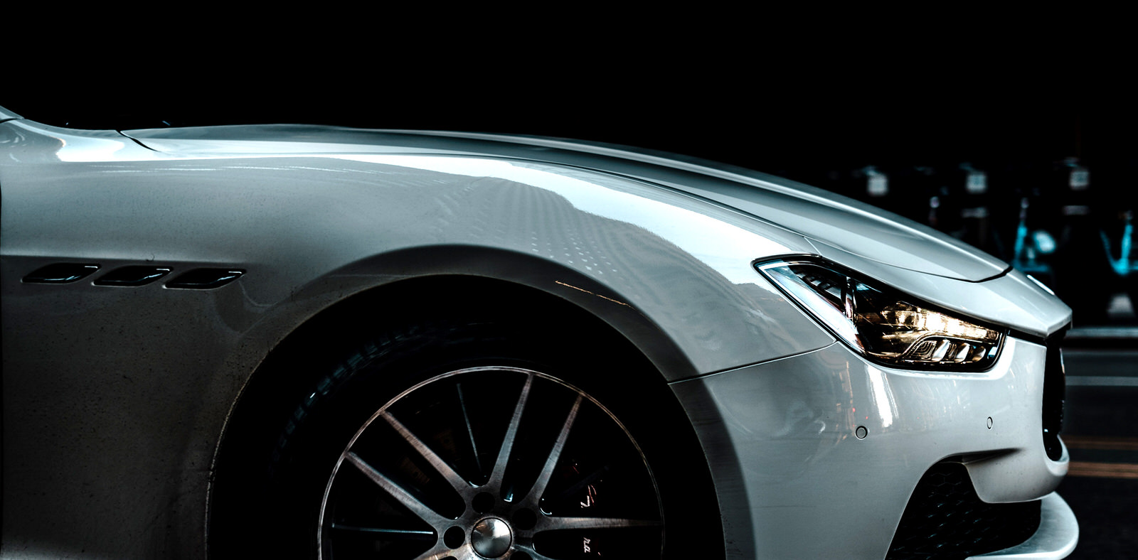 sleek white car inspected by Q2 Management Inc.